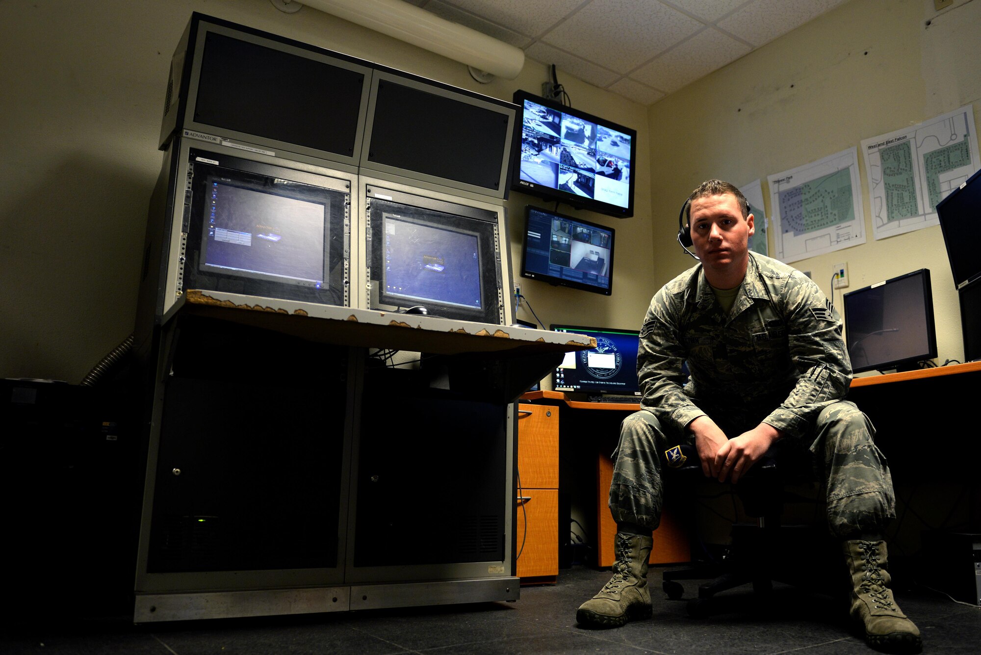 Senior Airman Douglas Sullivan, 81st Security Forces Squadron Base Defense Operations Center controller, poses for a photo in the alternate BDOC, Nov. 20, 2015, Keesler Air Force Base, Miss. Sullivan’s actions in helping a fellow Defender in a time of need exemplify what it means to be a wingman. (U.S. Air Force photo by Senior Airman Duncan McElroy)