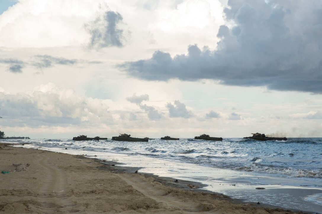 TANDUO BEACH, Malaysia (Nov. 11, 2015) U.S. Marines with Kilo Company, Battalion Landing Team 3rd Battalion, 1st Marine Regiment, 15th Marine Expeditionary Unit, and Malaysian soldiers hit the beach while they rehearse amphibious operations during Malaysia-United States Amphibious Exercise 2015. During MALUS AMPHEX 15, Marine fire teams paired with a squad of Malaysian soldiers and rehearsed amphibious assault tactics. The purpose of the exercise was to strengthen military cooperation in the planning and execution of amphibious operations between Malaysian armed forces and U.S. Marines. The 15th MEU is currently deployed in the Indo-Asia-Pacific region to promote regional stability and security in the U.S. 7th Fleet area of operations. (U.S. Marine Corps photo by Sgt. Emmanuel Ramos/Released)