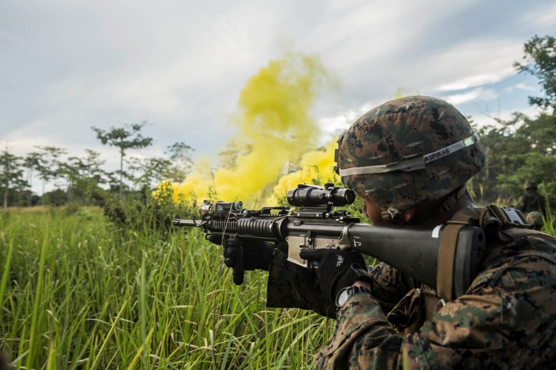 TANDUO BEACH, Malaysia (Nov. 11, 2015) U.S. Marine Lance Cpl. Joseph Aspiras closes in on his objective while training Malaysian soldiers on amphibious operations during Malaysia-United States Amphibious Exercise 2015. Aspiras is a rifleman with Kilo Company, Battalion Landing Team 3rd Battalion, 1st Marine Regiment, 15th Marine Expeditionary Unit. During MALUS AMPHEX 15, Marine fire teams paired with a squad of Malaysian soldiers and rehearsed amphibious assault tactics. The purpose of the exercise was to strengthen military cooperation in the planning and execution of amphibious operations between Malaysian armed forces and U.S. Marines. The 15th MEU is currently deployed in the Indo-Asia-Pacific region to promote regional stability and security in the U.S. 7th Fleet area of operations. (U.S. Marine Corps photo by Sgt. Emmanuel Ramos/Released)