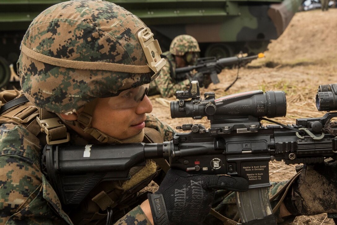 TANDUO BEACH, Malaysia (Nov. 13, 2015) U.S. Marine Lance Cpl. Jamie Camacho and Malaysian soldiers begin their amphibious beach assault during Malaysia-United States Amphibious Exercise 2015. Camacho is an automatic rifleman with Kilo Company, Battalion Landing Team 3rd Battalion, 1st Marine Regiment, 15th Marine Expeditionary Unit. During the culminating event, Malaysian soldiers alongside Marines assaulted the beach using tactics learned throughout MALUS AMPHEX 15. The purpose of the exercise was to strengthen military cooperation in the planning and execution of amphibious operations between Malaysian armed forces and U.S. Marines. The 15th MEU is currently deployed in the Indo-Asia-Pacific region to promote regional stability and security in the U.S. 7th Fleet area of operations. (U.S. Marine Corps photo by Sgt. Emmanuel Ramos/Released)