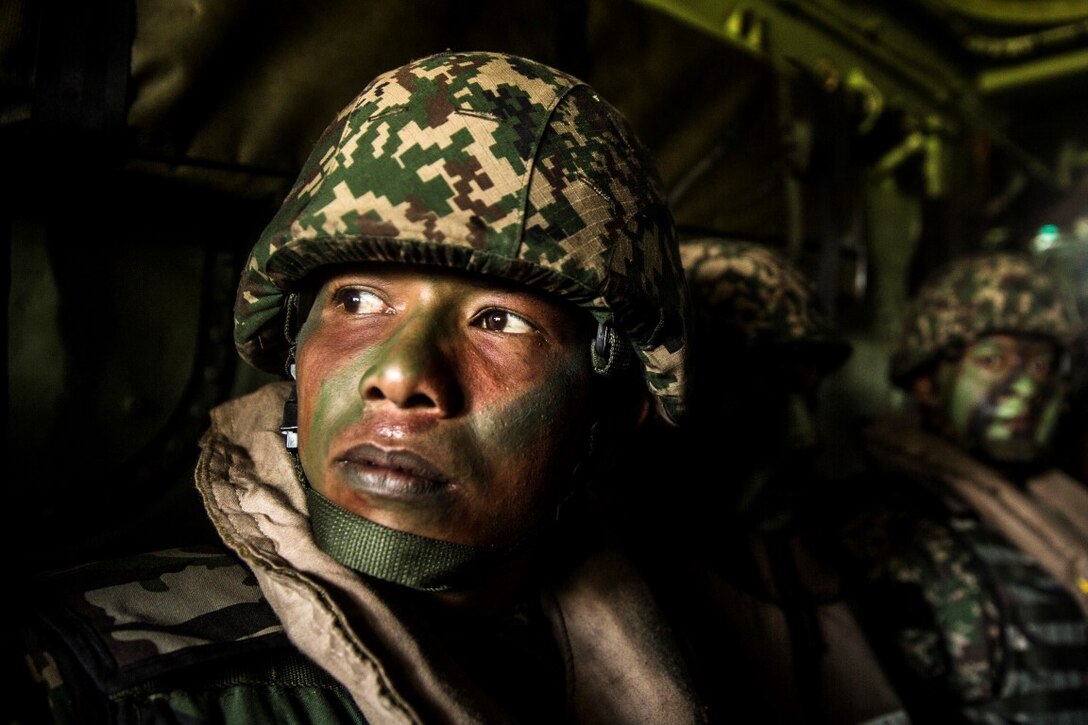 TANDUO BEACH, Malaysia (Nov. 13, 2015) A Malaysian soldier prepares to assault Tanduo Beach during Malaysia-United States Amphibious Exercise 2015. During the culminating event, Malaysian soldiers alongside U.S. Marines with Kilo Company, Battalion Landing Team 3rd Battalion, 1st Marine Regiment, 15th Marine Expeditionary Unit, assaulted the beach using tactics learned throughout MALUS AMPHEX 15. The purpose of the exercise was to strengthen military cooperation in the planning and execution of amphibious operations between Malaysian armed forces and U.S. Marines. The 15th MEU is currently deployed in the Indo-Asia-Pacific region to promote regional stability and security in the U.S. 7th Fleet area of operations. (U.S. Marine Corps photo by Sgt. Emmanuel Ramos/Released)