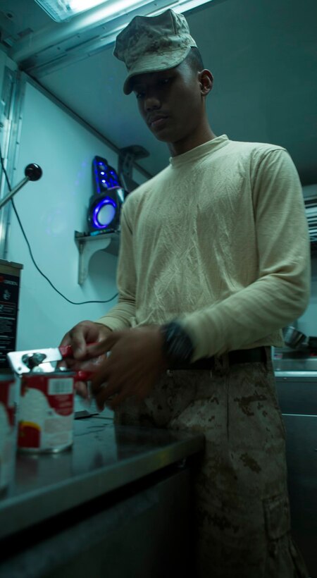 U.S. Marine Cpl. William Yaporagiles, a food services specialist with Combat Logistics Battalion 1, Special Purpose Marine Air Ground Task Force-Crisis Response-Central Command, opens a can of cranberries in preparation for evening chow at Al Taqaddum Air Base, Iraq, Nov. 7, 2015. Yaporagiles spends his days cooking and serving U.S. and coalition forces at Camp Manion in support of Combined Joint Task Force-Operation Inherent Resolve. (U.S. Marine Corps photo by Sgt. Owen Kimbrel)
