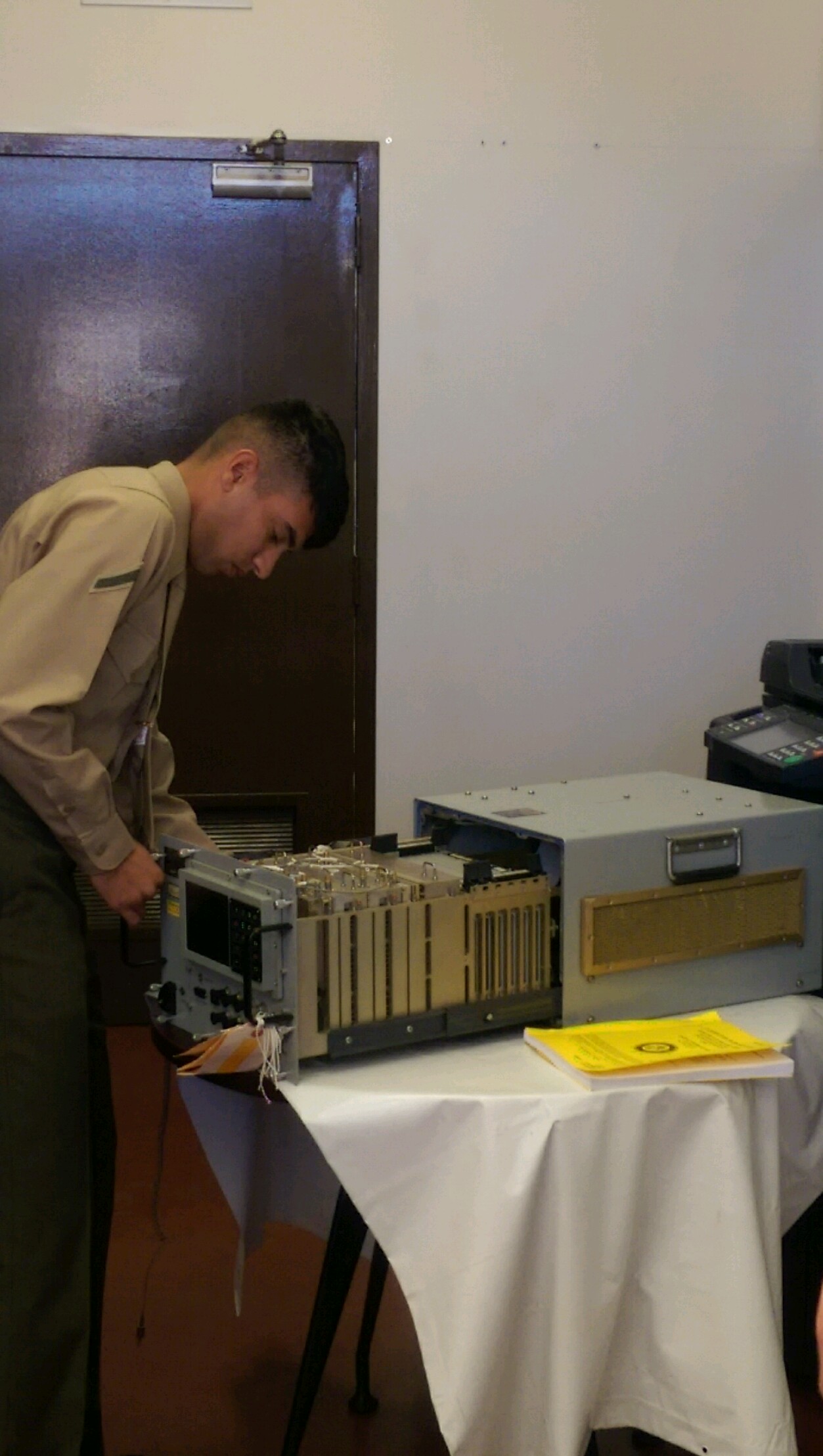 Marines learning 5948 Radar Repair MOS learn preventative and corrective maintenance on the AN/TPS-63B and AN/TPSA-59(V)3 radars.  Included in this training is Radar Fundamentals where Marines learn radar theory, basic pulse radar, analog and digital radars, and IFF.  Here, PFC Dustin J. Chaudhry is replacing a card in the UPX-37 Digital Interrogator as part of a performance exam in Aviation Radar Fundamentals.  