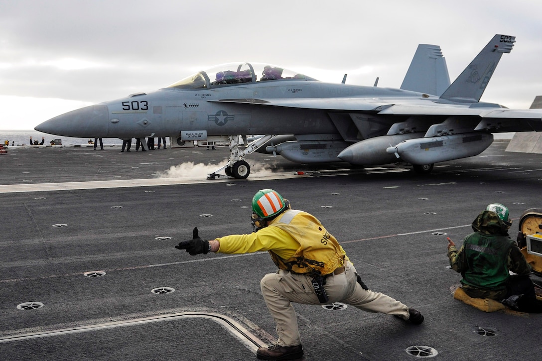 An E/A-18G Growler launches off the flight deck of the aircraft carrier USS Theodore Roosevelt in the Pacific Ocean, Nov. 21, 2015. The Growler is assigned to Electronic Attack Squadron 137. U.S. Navy photo by Petty Officer Seaman Chad M. Trudeau