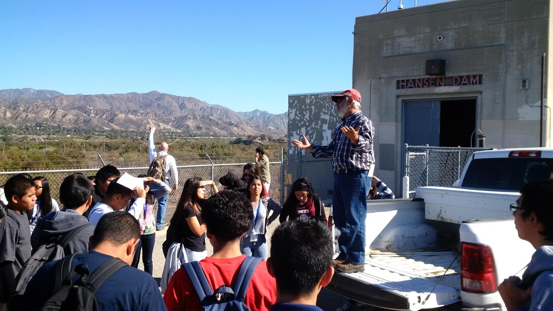 Dam Operations Supervisor Louis Munoz talks to area high school students about the operation of Hansen Dam, a U.S. Army Corps of Engineers Los Angeles District flood risk reduction project located in the San Fernando Valley, during a tour of the basin Nov. 19.