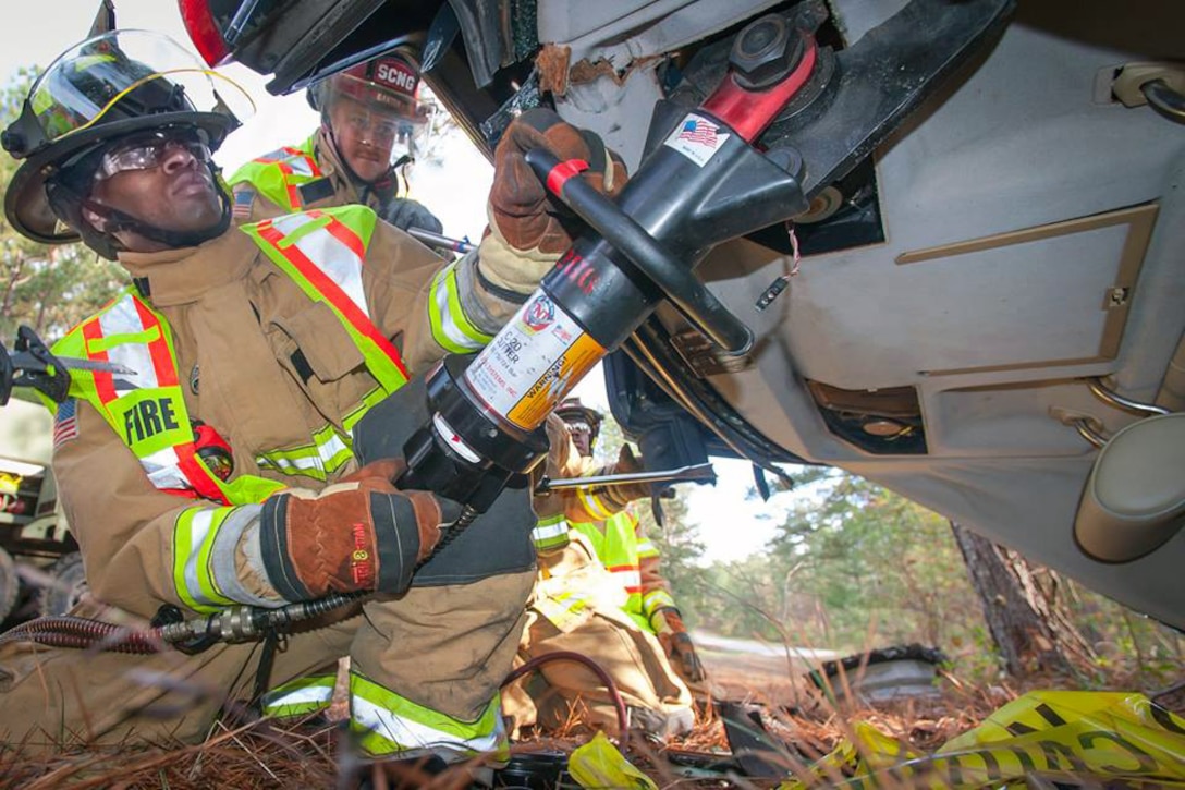 Army firefighters respond to a simulated accident scene during an auto extraction exercise on McCrady Training Center near Eastover, S.C., Nov. 15, 2015. The firefighters are assigned to the South Carolina Army National Guard. U.S. Army photo by Sgt. Brian Calhoun