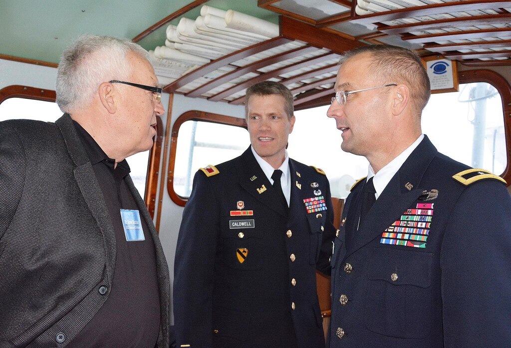 Mr. Steve Stockton, HQ USACE Director of Civil Works speaks with Brig. Gen. William Graham, CG USACE North Atlantic Division and Col. David Caldwell, Cmdr. USACE New York District while underway on a USACE vessel in the New York Harbor.  The USACE leaders met with the Chinese Minister of Water Resources and Delegation regarding post Sandy efforts.