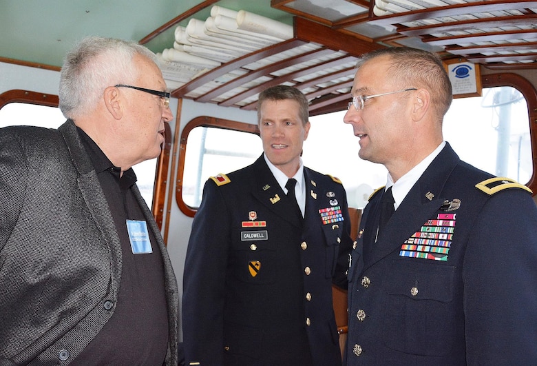 Mr. Steve Stockton, HQ USACE Director of Civil Works speaks with Brig. Gen. William Graham, CG USACE North Atlantic Division and Col. David Caldwell, Cmdr. USACE New York District while underway on a USACE vessel in the New York Harbor.  The USACE leaders met with the Chinese Minister of Water Resources and Delegation regarding post Sandy efforts.