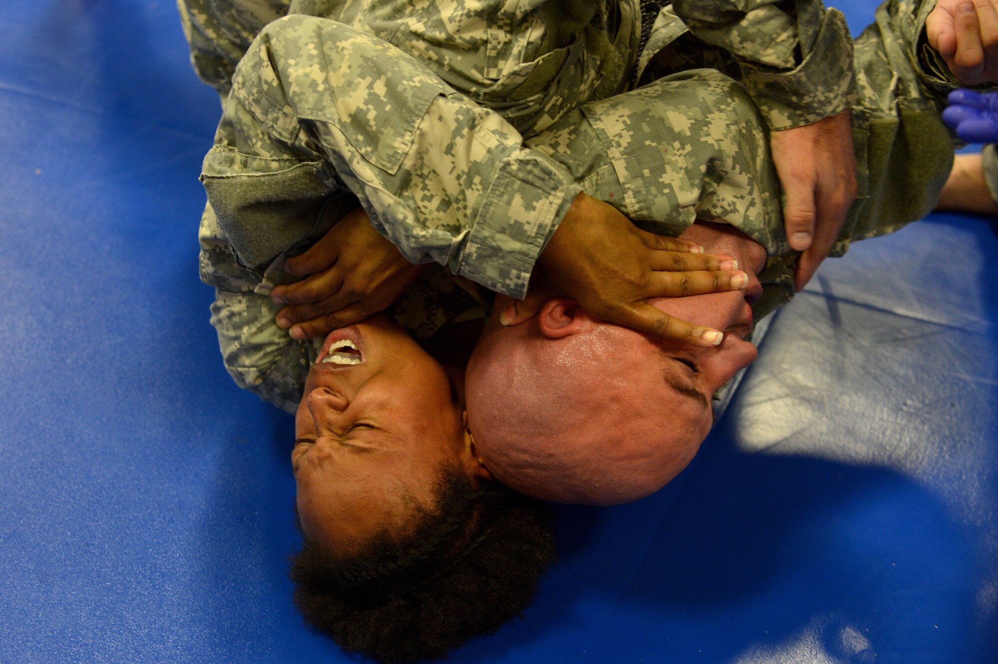 A Level I Army Combative student performs a “rear naked choke” during a test to become a certified Level I instructor at the Combatives House at Shaw Air Force Base, S.C., Nov. 12, 2015. The Combatives House was created Jan. 2015, to provide a facility where combatives, martial arts, and other fitness programs can flourish and assist personnel obtain new skills and healthier habits.  (U.S. Air Force photo by Senior Airman Diana M. Cossaboom)