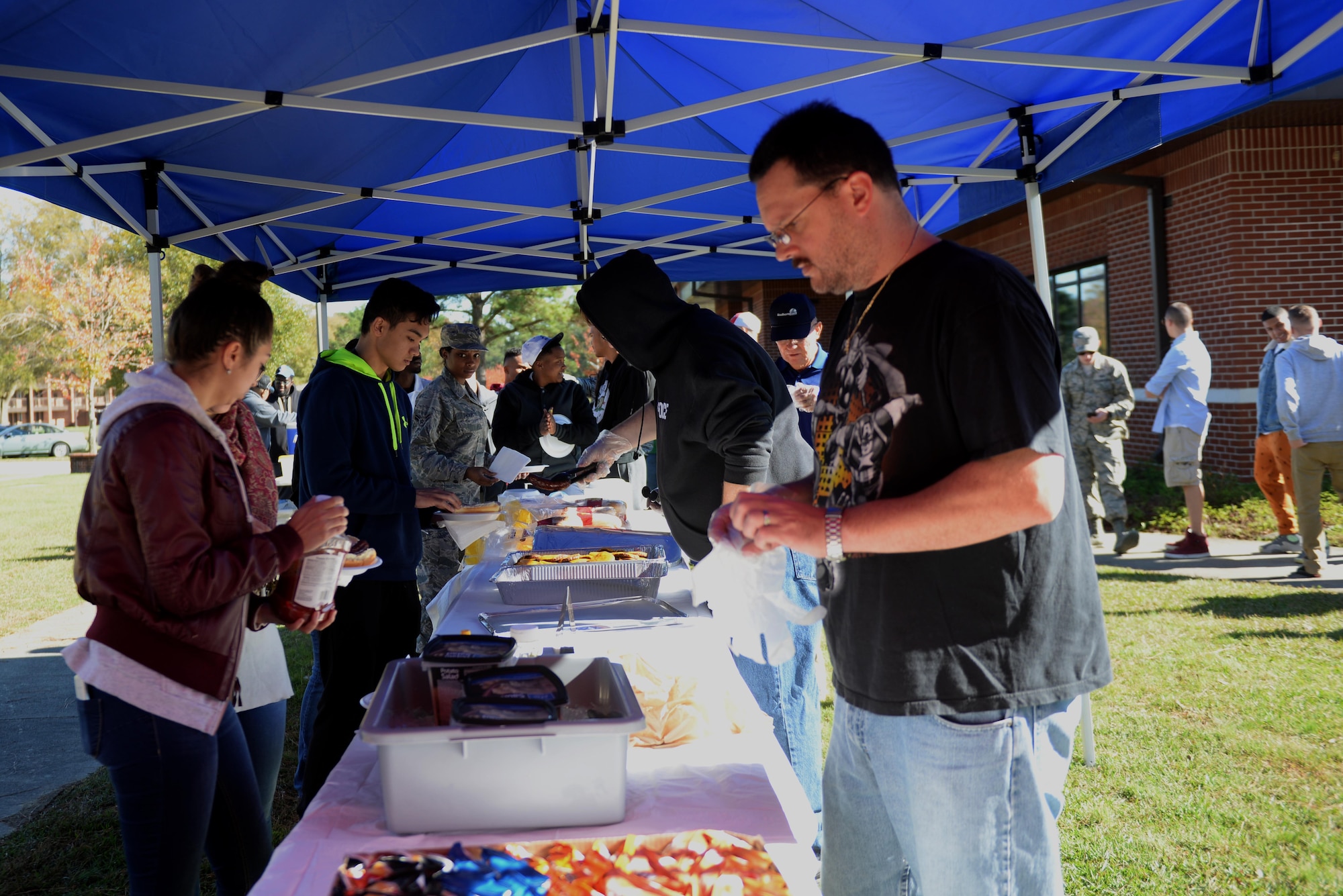 Team Seymour Airmen line up for food during the grand re-opening of the Oasis Airmen Ministry Center, Nov. 21, 2015, at Seymour Johnson Air Force Base, North Carolina. The event was hosted by the chaplain corps to promote the new facility and encourage social resilience. (U.S. Air Force photo/Airman 1st Class Ashley Williamson)