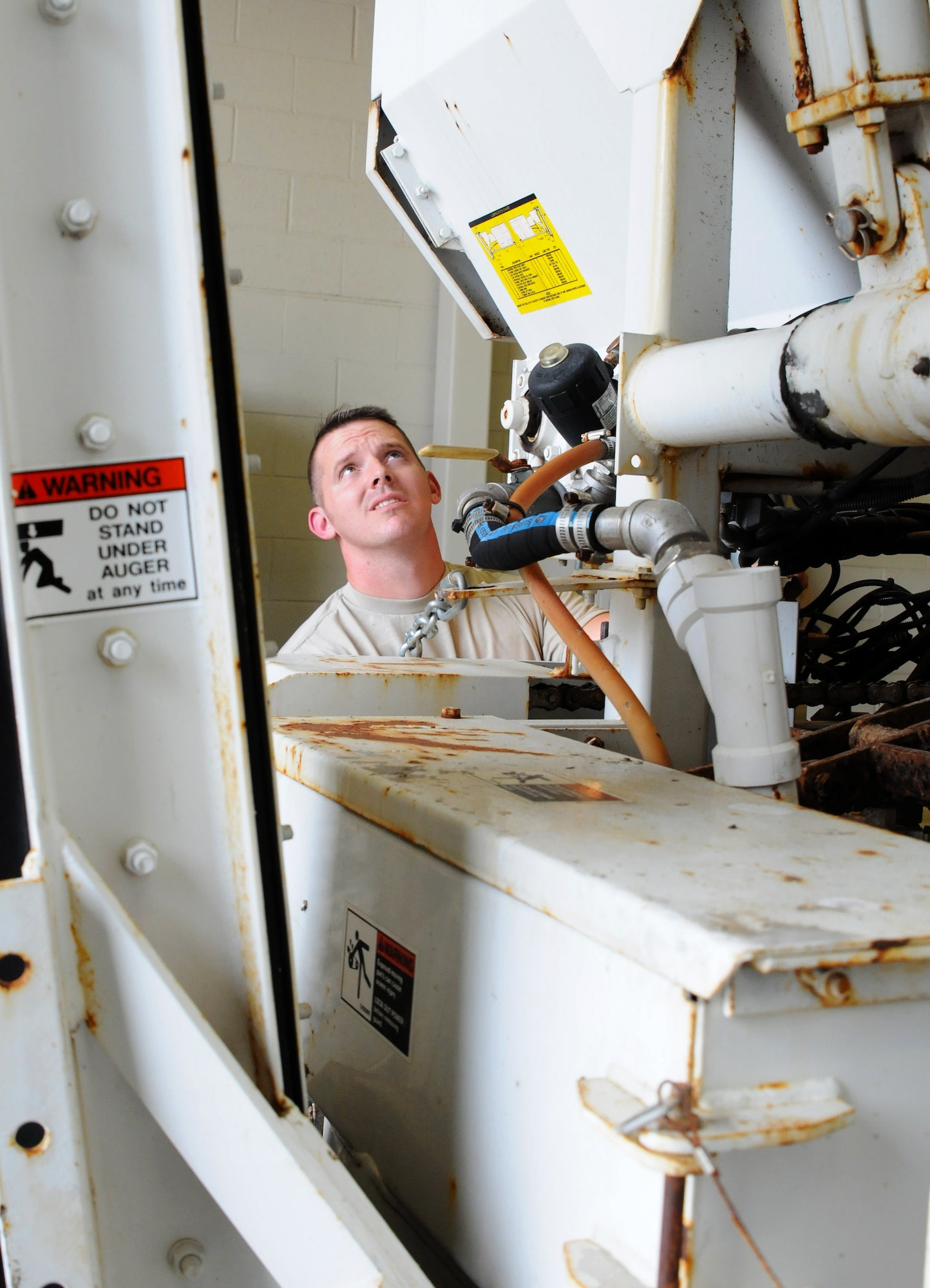 Tech. Sgt. Christopher Corbit, vehicle mechanic, operates on a Zim mixer Oct. 7, 2015, at Ebbing Air National Guard Base, Fort Smith, Ark.  Airmen within Vehicle Maintenance handle all maintenance concerns for registered vehicles and technical support for ex-registered vehicles. (U.S. Air National Guard photo by Senior Airman Cody Martin/Released)