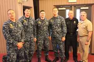 Recently, Lieutenant Commander Timothy McMichael, JB Charleston 628th Security Force Squadron, deputy commander (left) and Capt. Timothy Sparks, Joint Base Charleston - Naval Weapons Station commander (right) presented small craft qualification insignia to Master at Arms First Class Ethan Holland, Master at Arms First Class Mark Van Wyck, Master at Arms Second  Brian Cobb and Mr. Scott Olson.

By achieving the small craft insignia these individuals are recognized as subject matter experts in harbor patrol operations.  The qualifying process includes seamanship and navigation training, maritime security patrol operations, two tactical exercises and an oral board.
