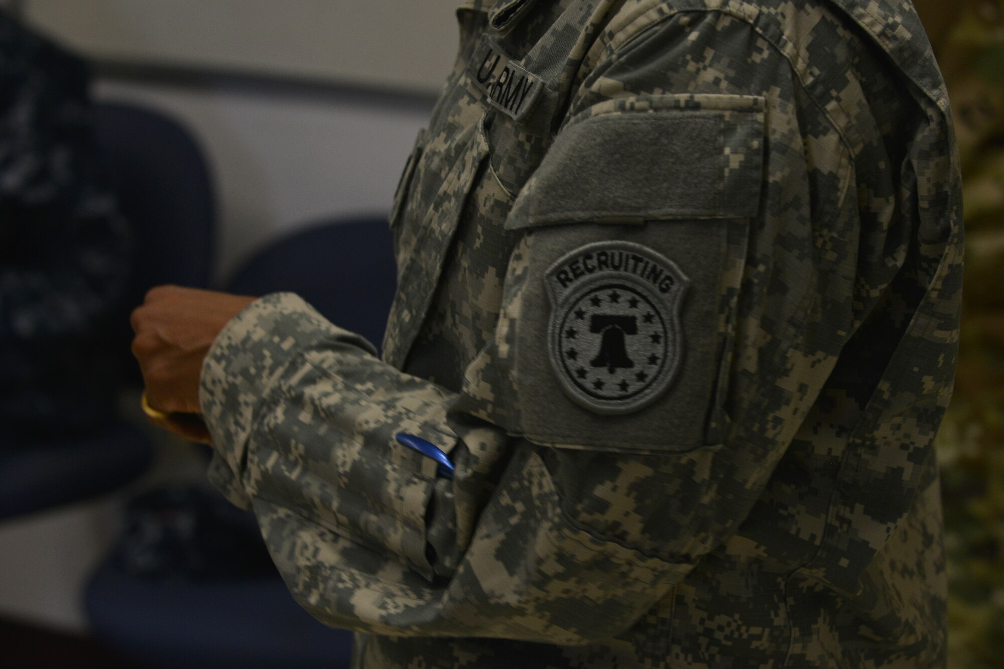 U.S. Army Chief Warrant Officer 4 Crystal Davis, a recruiter with U.S. Army Special Operations Recruiting Battalion (Airborne), goes over applying for the warrant officer program during the education and career fair at Fort Eustis, Va., Nov. 18, 2015. Davis briefed on what enlisted fields transfer into warrant officer jobs ranging from intelligence, mechanics, logistics, aviation and more. (U.S. Air Force photo by Staff Sgt. Natasha Stannard)  