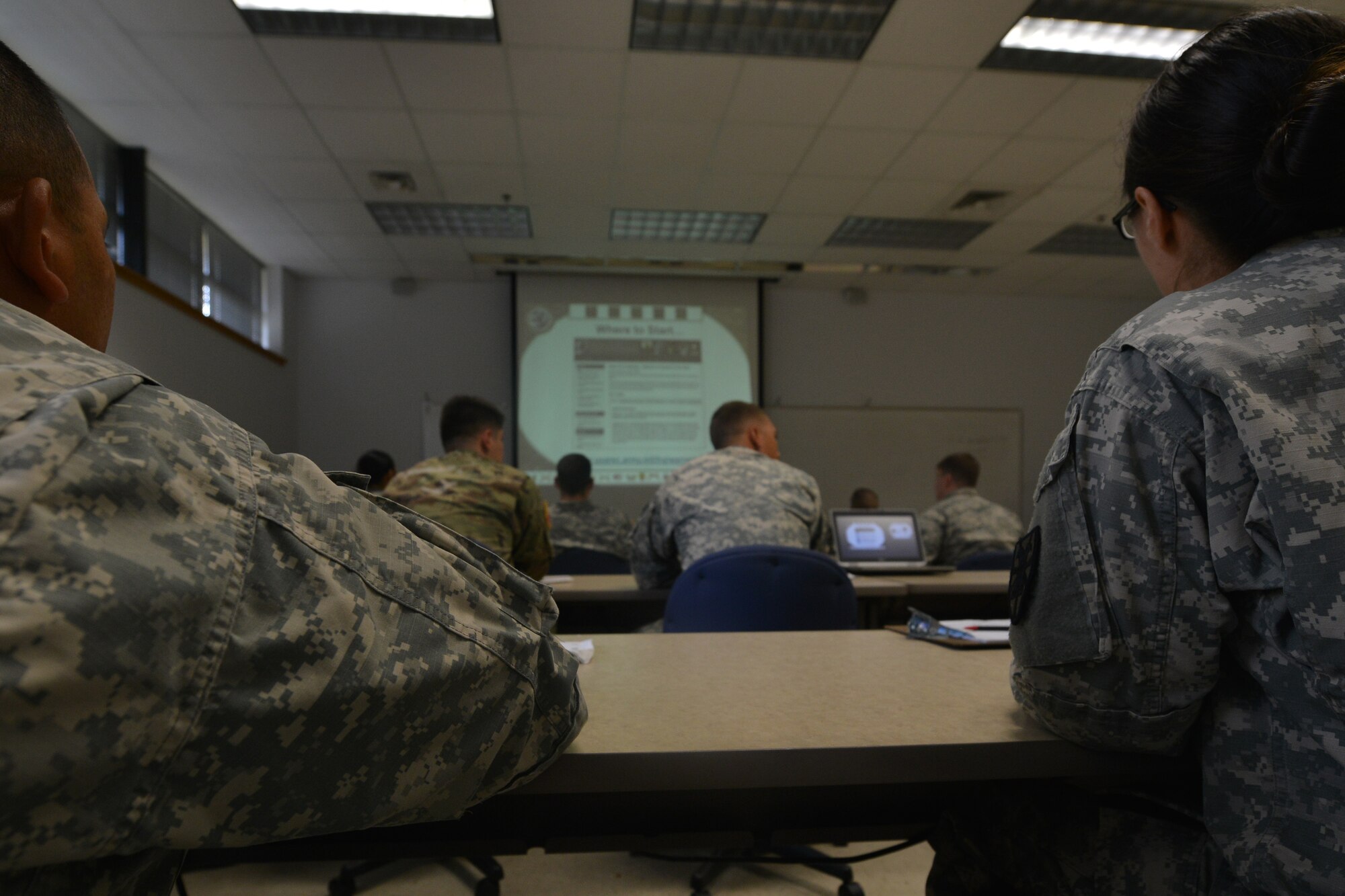 Alan Fiorello, an academic outreach manager with the University of Virginia, goes over the university’s programs and resources with U.S. Army Master Sgt. Lloyd Scott, a career counselor with U.S. Army Training and Doctrine Command, at Fort Eustis, Va., Nov. 18, 2015.  Fiorello represented one of the many schools and programs at the education and career fair held in accordance with American Education Week. (U.S. Air Force photo by Staff Sgt. Natasha Stannard)  