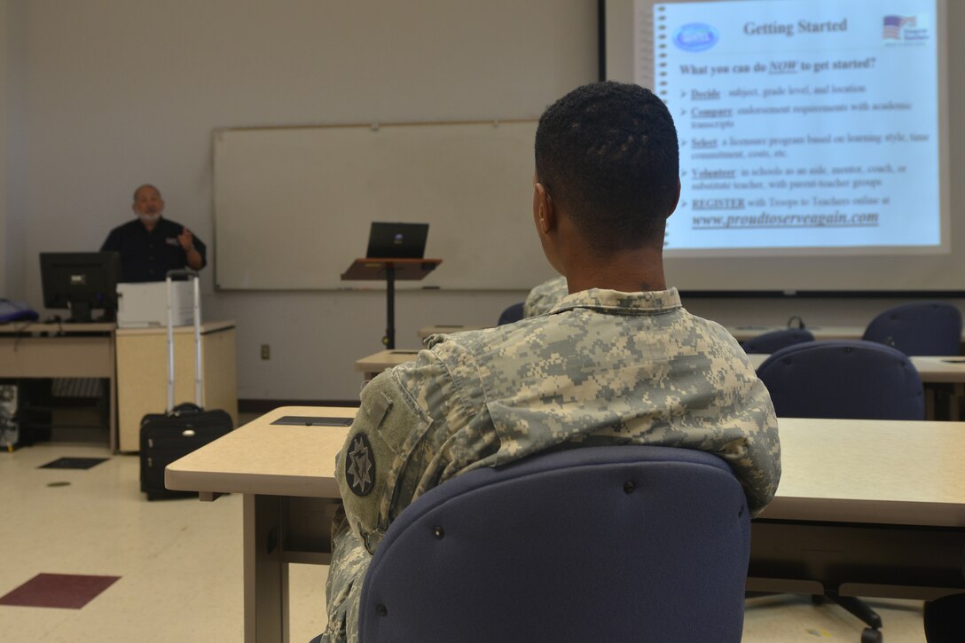 Art Lensky, a counselor with Troops to Teachers, goes over how to apply for the program during the education and career fair at Fort Eustis, Va., Nov. 18, 2015. The Fort Eustis Education Center hosted the fair to offer U.S. Service members and their families the opportunity to get immediate responses from university and program representatives. (U.S. Air Force photo by Staff Sgt. Natasha Stannard)  