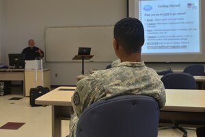 Art Lensky, a counselor with Troops to Teachers, goes over how to apply for the program during the education and career fair at Fort Eustis, Va., Nov. 18, 2015. The Fort Eustis Education Center hosted the fair to offer U.S. Service members and their families the opportunity to get immediate responses from university and program representatives. (U.S. Air Force photo by Staff Sgt. Natasha Stannard)  