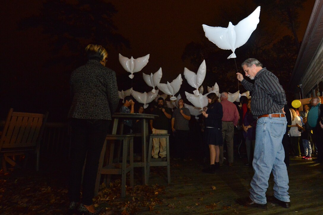 Gold Star family members release biodegradable balloons at the 5th Annual Survivor Outreach Services’ Thanks for Giving social at Fort Eustis, Va., Nov. 19, 2015. The balloons represented letting go of the pain and hardship faced when losing a loved one. (U.S. Air Force photo by Staff Sgt. Natasha Stannard)