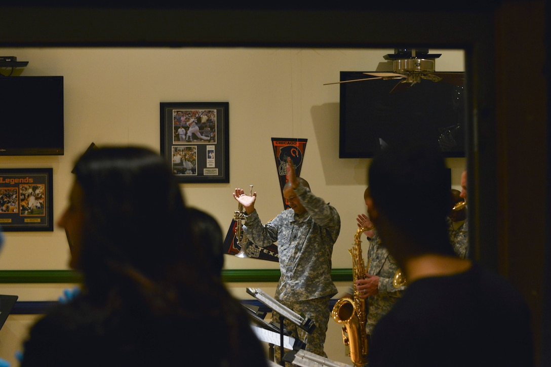 The U.S. Army Training and Doctrine Command Band perform for attendees during a Survivor Outreach Services (SOS) Thanks For Giving social at Fort Eustis, Va., Nov. 19, 2015. This was the 5th annual Thanks For Giving, which was hosted by SOS to show gratitude for the sacrifices Gold Star family members’ loved ones made for their country. (U.S. Air Force photo by Staff Sgt. Natasha Stannard)