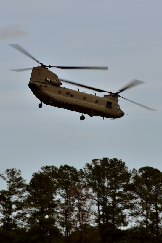 A U.S. Army Reserve CH-47 Chinook takes off for a sling load training exercise at Felker Army Air Field at Fort Eustis, Va., Nov. 18, 2015. The Chinook can carry up to 33 Soldiers traveling with gear and weapons. In rare stances, the Chinook can convert into a medical evacuation aircraft, and carry up to 24 litters. (U.S. Air Force photo by Staff Sgt. Natasha Stannard)  