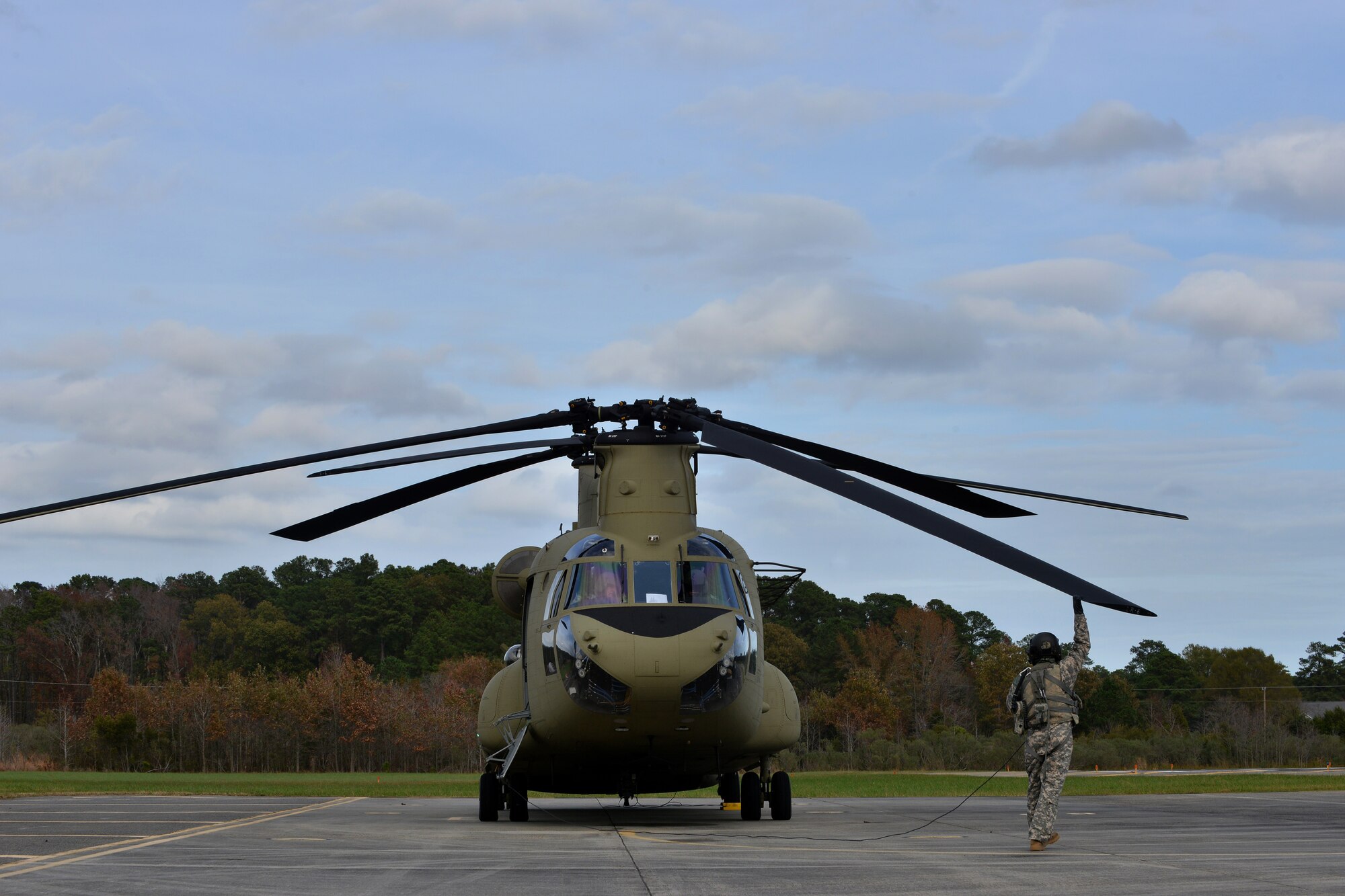U.S. Army Reserve Staff Sgt. Job Smith, a crew member assigned to B Company, 5th Battalion (General Support) Aviation, 159th Aviation Regiment, checks the wing of a CH-47 Chinook at Felker Army Air Field, Fort Eustis, Va., Nov. 18, 2015. Chinooks are twin-engine, rotor heavy-lift helicopters that travel up to 196 miles per hour. As one of the fastest helicopters to date, they are designed to aid in troop movement, weapon placement and re-supply during deployments. (U.S. Air Force photo by Staff Sgt. Natasha Stannard)  