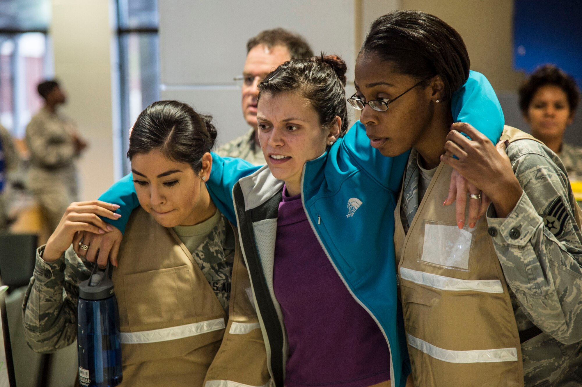 A simulated victim is escorted to the hospital during an active shooter exercise at Langley Air Force Base, Va., Nov. 19, 2015. Medical personnel were responsible for mass casualty response, triage and treatment of victims. (U.S. Air Force photo by Senior Airman Kayla Newman)