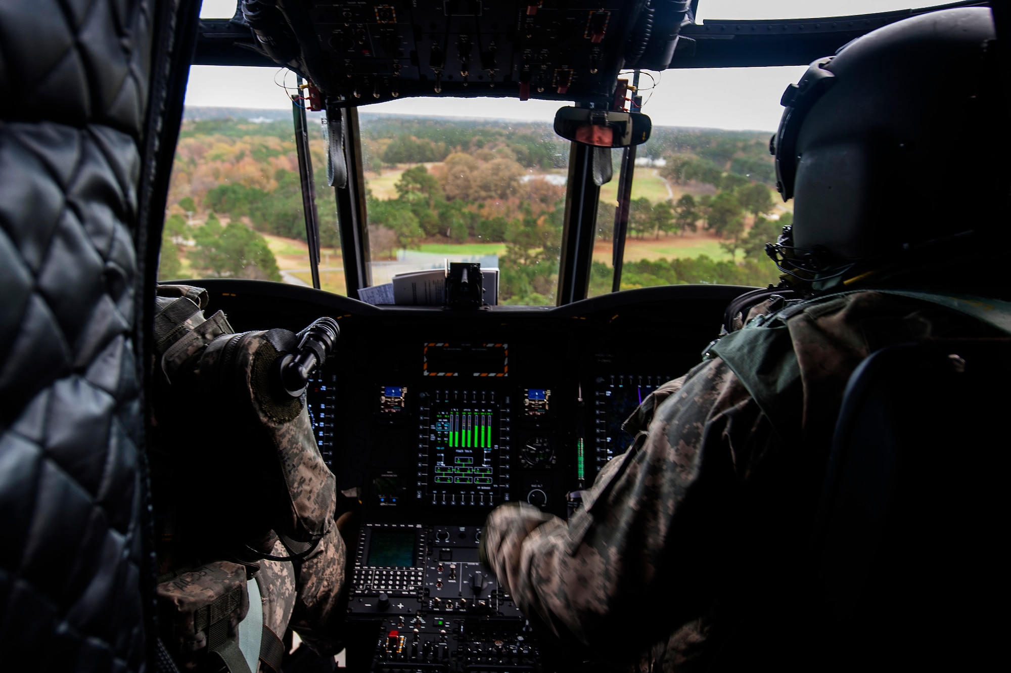 U.S. Army Chief Warrant Officer 4 Glenn Coffin, a pilot assigned to B Company, 5th Battalion (General Support) Aviation, 159th Aviation Regiment, flies a CH-47 Chinook during a training mission at Felker Army Air Field, Fort Eustis, Va., Nov. 18, 2015. As pilots and crew members in the Reserves, Coffin and his crew must retain the same flying hours as their active duty counterparts in order to maintain their certification. (U.S. Air Force photo by Senior Airman Breonna Veal) 