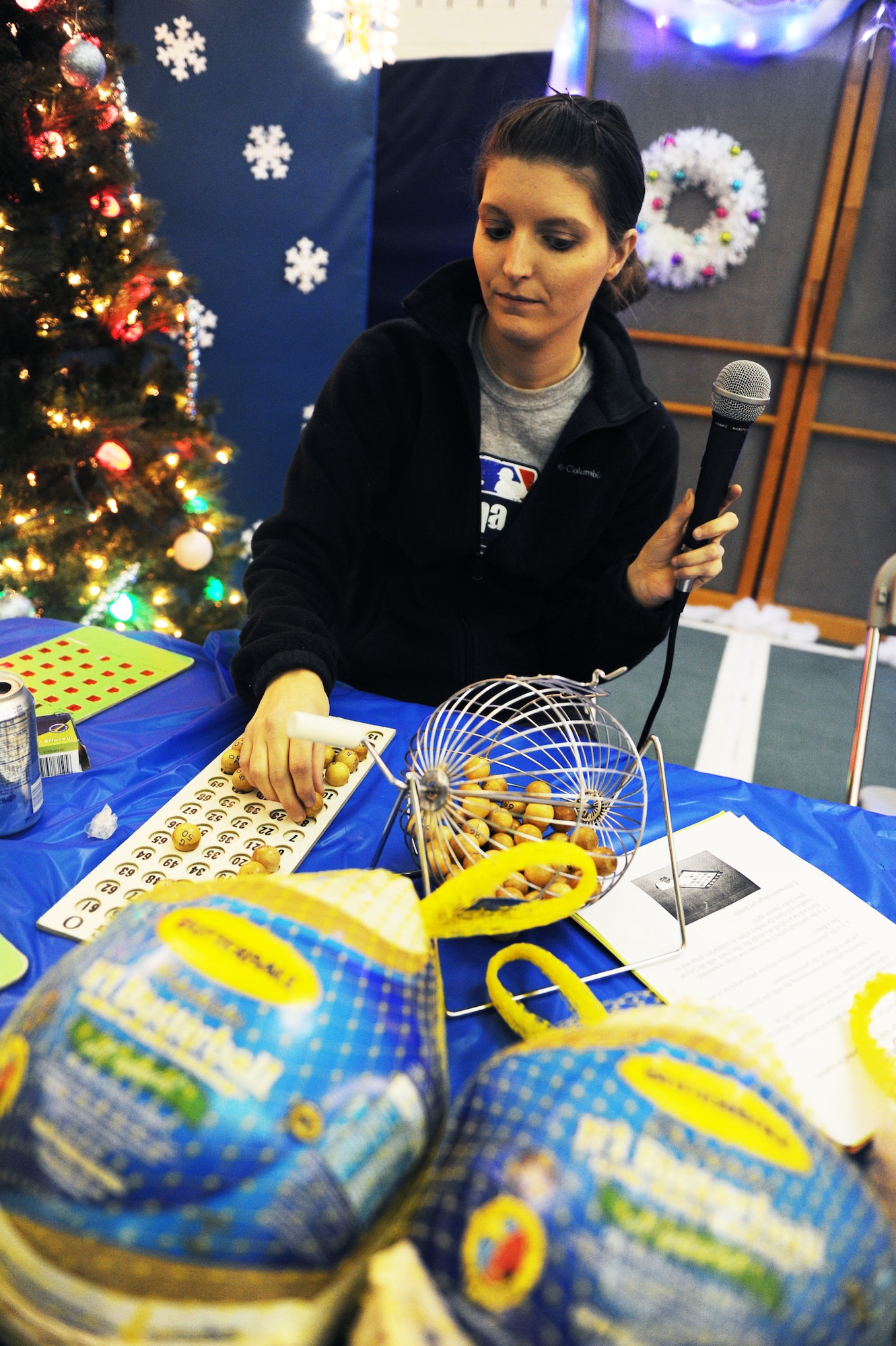 Stephanie Hazen calls out numbers during the annual Turkey Bingo event at the youth center at Minot Air Force Base, N.D., Nov. 21, 2015. This was the 11th year the youth center has held the Turkey Bingo and is part of many events during the year. (U.S. Air Force photo by Staff Sgt. Chad Trujillo)