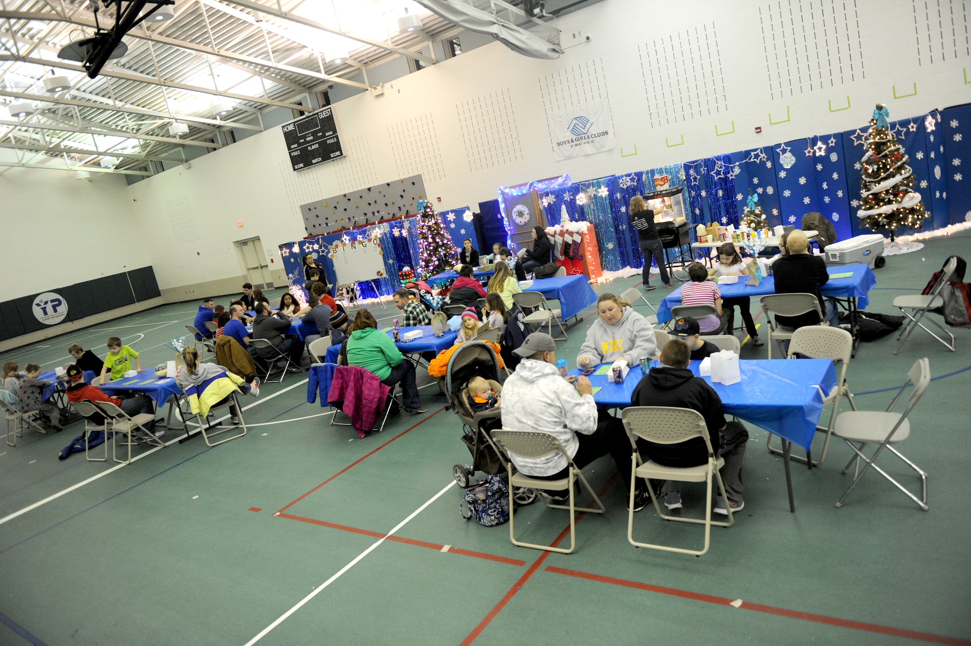 Families from Minot Air Force Base play bingo during the annual Turkey Bingo event at the youth center at Minot Air Force Base, N.D., Nov. 21, 2015. This was the 11th year the youth center has held the Turkey Bingo and is part of many events during the holiday season.(U.S. Air Force photo by Staff Sgt. Chad Trujillo)