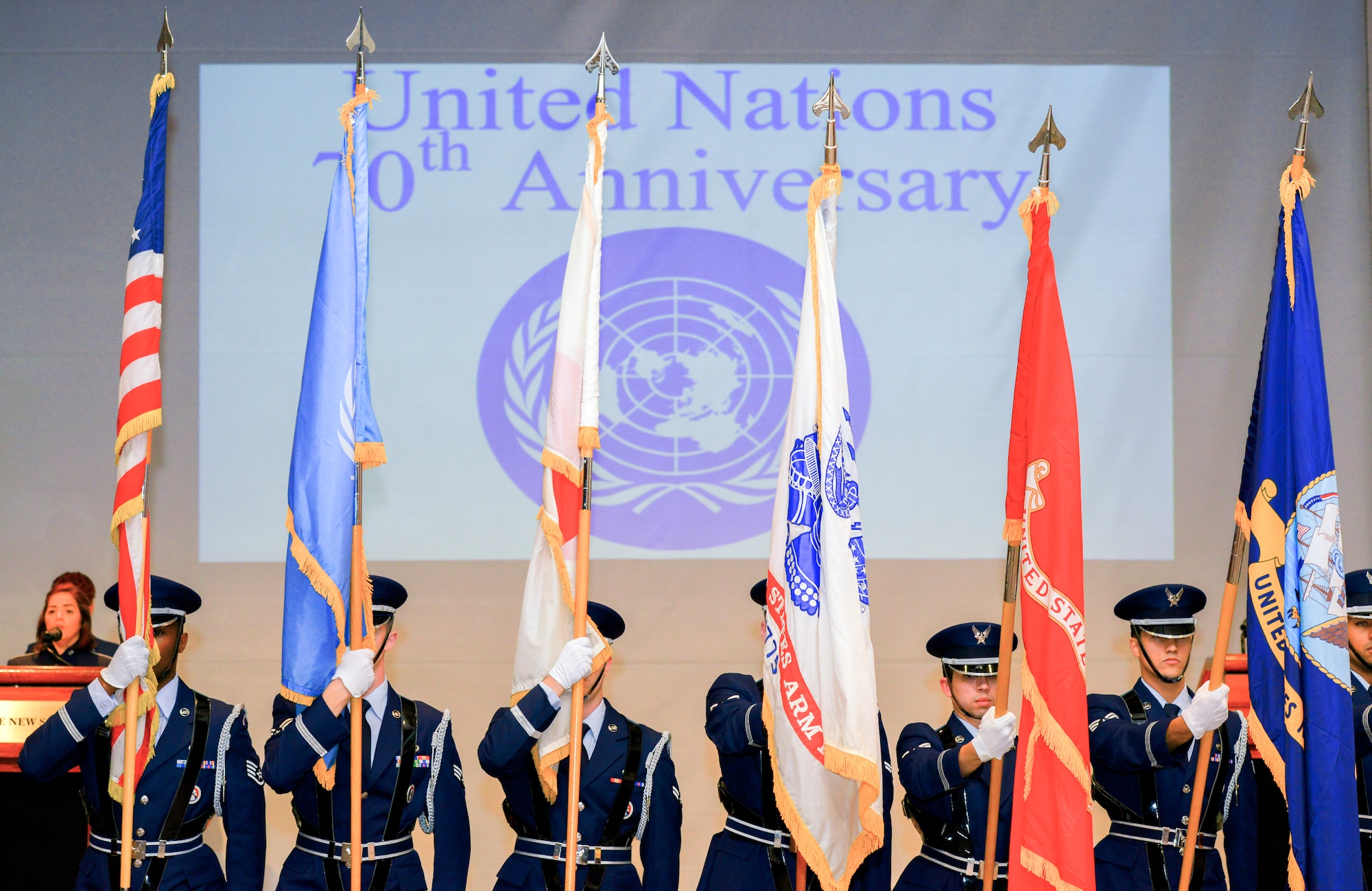 Members of the Yokota Air Base honor guard present the colors during the United Nations Day 70th Anniversary Celebration in Tokyo, Japan, Nov. 16, 2015. UN Day commemorates the anniversary of the entry into force of the United Nations Charter in 1945 and has been celebrated as UN Day since 1948. The day also provides an opportunity for the UNC, a unified command structure for the multinational military forces supporting South Korea, to show its appreciation for the ongoing support from sending states, supporting organizations and Japan, and to reinforce the value to regional security and stability. Attendees include ambassadors, diplomats, members of the Japanese Ministry of Foreign Affairs and Ministry of Defense, Japanese Self-Defense Forces and United States Forces, Japan, senior military officers. The event was staged by the United Nations Command Rear which has been located at Yokota since 2007.  (U.S. Air Force photo by Airman 1st Class Elizabeth Baker/Released)        