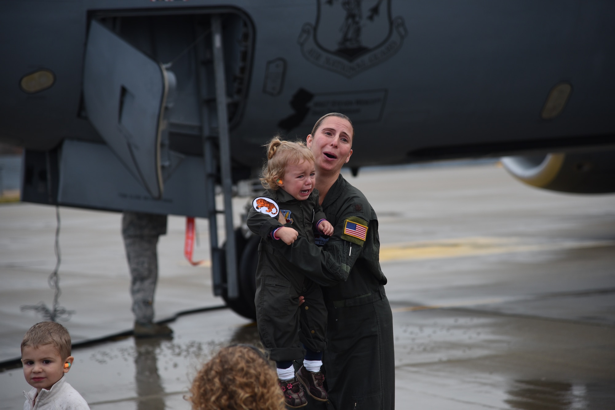 Maj. Sharon Gilliand, a KC-135 Stratotanker pilot with the 108th Wing, receives a celebratory spraying from her husband Maj. Kiel Gilliand, children Garrett and Lacey, fellow pilots and crew members following her final flight for the 108th Wing at Joint Base Mcguire-Dix-Lakehurst on Nov. 5, 2015. Gilliland, a pilot for 12 years with the New Jersey Air National Guard’s 108th Wing is ceremonially hosed down as she leaves piloting to others and takes a non-flying job with the 514th AMOS, Air Force Reserve so she can devote more time to her family. During her time in the 108th Wing, Gilliland deployed three times and has 60 combat sorties to her credit. (U.S. Air National Guard photo by Master Sgt. Carl Clegg/Released)