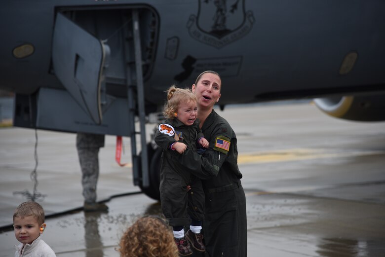 Maj. Sharon Gilliand, a KC-135 Stratotanker pilot with the 108th Wing, receives a celebratory spraying from her husband Maj. Kiel Gilliand, children Garrett and Lacey, fellow pilots and crew members following her final flight for the 108th Wing at Joint Base Mcguire-Dix-Lakehurst on Nov. 5, 2015. Gilliland, a pilot for 12 years with the New Jersey Air National Guard’s 108th Wing is ceremonially hosed down as she leaves piloting to others and takes a non-flying job with the 514th AMOS, Air Force Reserve so she can devote more time to her family. During her time in the 108th Wing, Gilliland deployed three times and has 60 combat sorties to her credit. (U.S. Air National Guard photo by Master Sgt. Carl Clegg/Released)