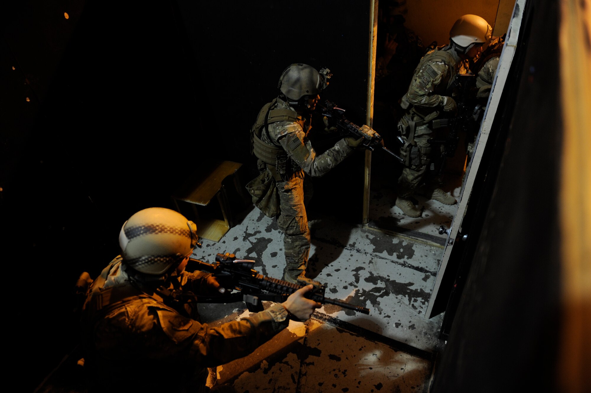 791st Missile Security Forces Squadron tactical response force members clear a room at Minot Air Force Base, N.D., Oct. 14, 2015. The mission of TRF is to respond to hostile attacks anywhere they occur within the 91st Missile Wing ICBM complex and to use all means necessary to defeat the adversary. (U.S. Air Force photo/Airman 1st Class Sahara L. Fales)