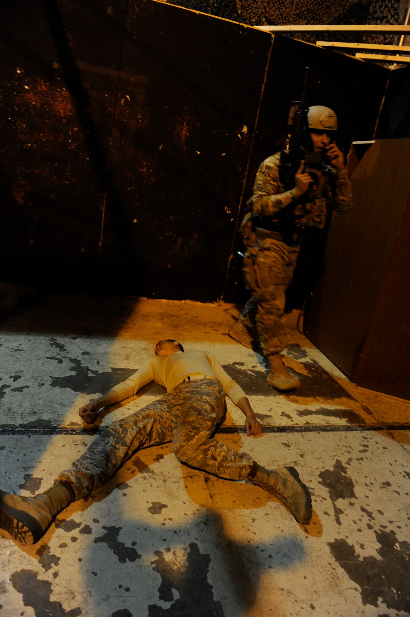 A 791st Missile Security Forces Squadron tactical response force member clears a room after taking down a simulated aggressor at Minot Air Force Base, N.D., Oct. 14, 2015. TRF specializes in close quarters battle where the objective is to neutralize enemies, clear the building and secure any assets. (U.S. Air Force photo/Airman 1st Class Sahara L. Fales)