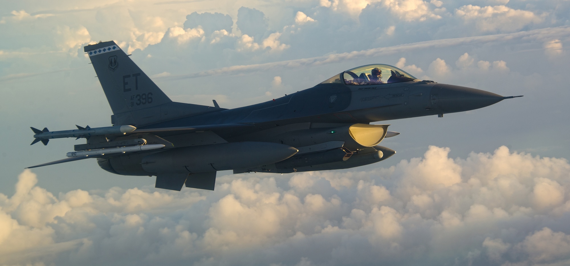 Capt. Timothy Fulkerson, F-16 Fighting Falcon pilot from the 40th Flight Test Squadron soars through the clouds while on a captive avionics test bed mission on Sept. 16. (U.S. Air Force photo/Staff Sgt. Brandy Hansen)