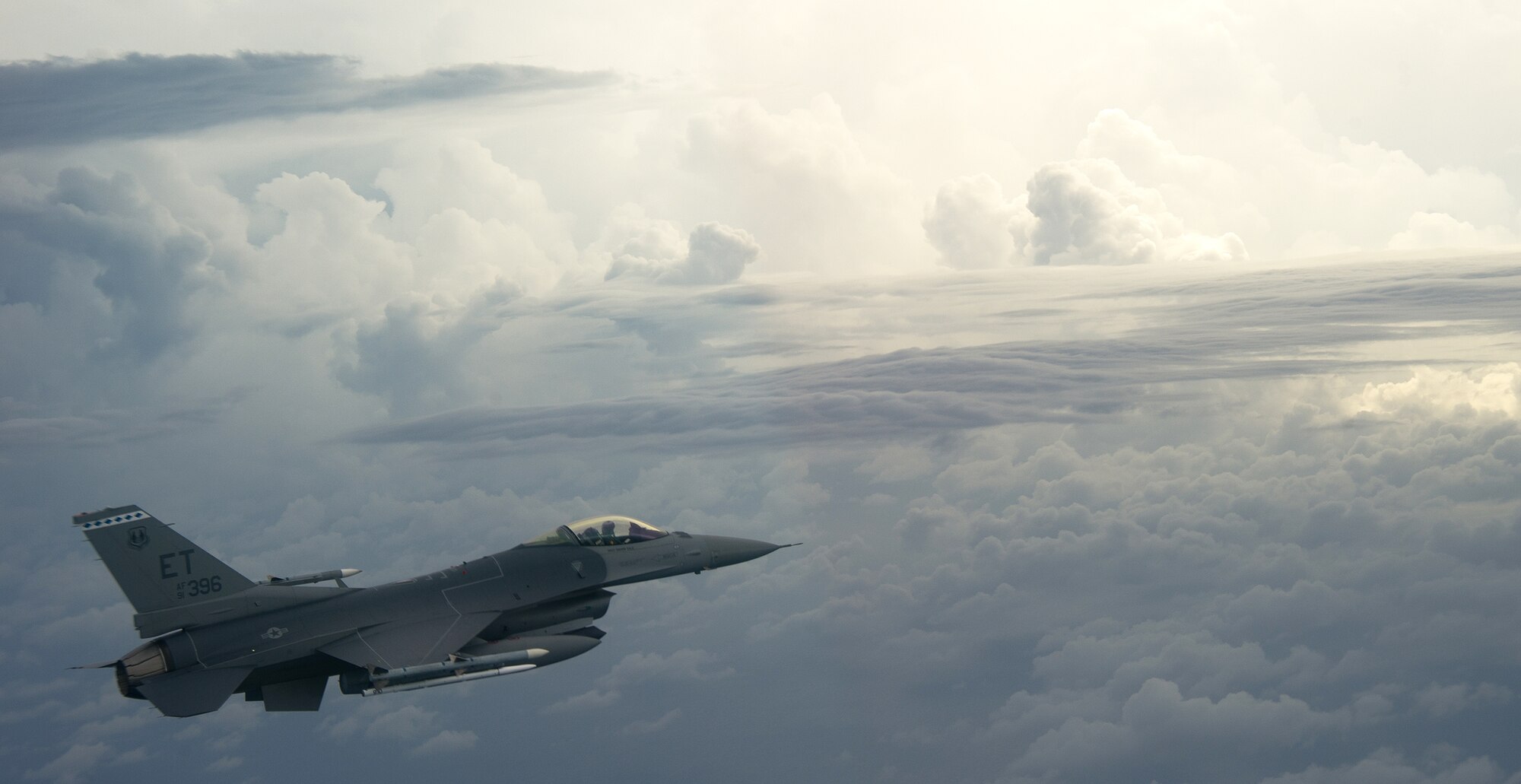 Capt. Timothy Fulkerson, F-16 Fighting Falcon pilot from the 40th Flight Test Squadron soars through the clouds while on a captive avionics test bed mission on Sept. 16. (U.S. Air Force photo/Staff Sgt. Brandy Hansen)