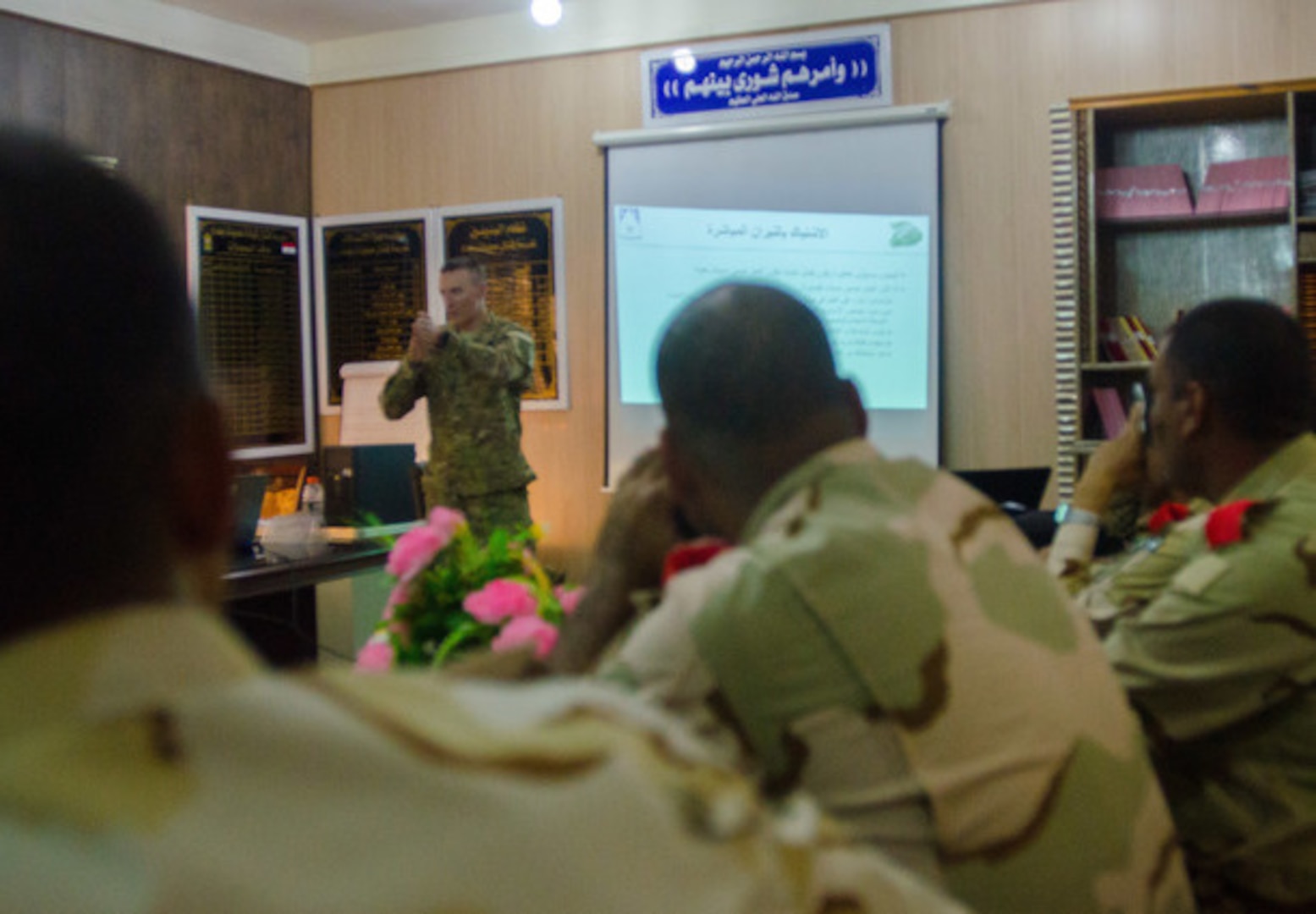 U.S. Army 2nd Lt. Kenneth Seamans, a platoon leader with Alpha Company, 1st Battalion, 87th Infantry Regiment, 10th Mountain Division (LI), demonstrates how to react to direct enemy contact during a class for Iraqi Security Force officers at the Baghdad Fighting School in Taji, Iraq, Nov. 1, 2015.