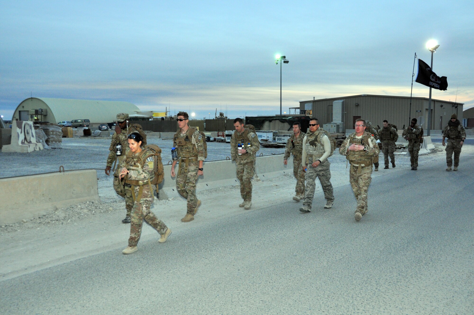 Members of the 386th Expeditionary Civil Engineer Squadron Explosive Ordnance Disposal flight participate in a four-mile ruck march to begin their annual EOD Safety Down Day at an undisclosed location in Southwest Asia, Nov. 23, 2015.  The EOD safety down day is held annually across the Air Force in November and addresses safety as well as the four pillars of Comprehensive Airman Fitness.  (U.S. Air Force photo by Master Sgt. Kevin Nichols)