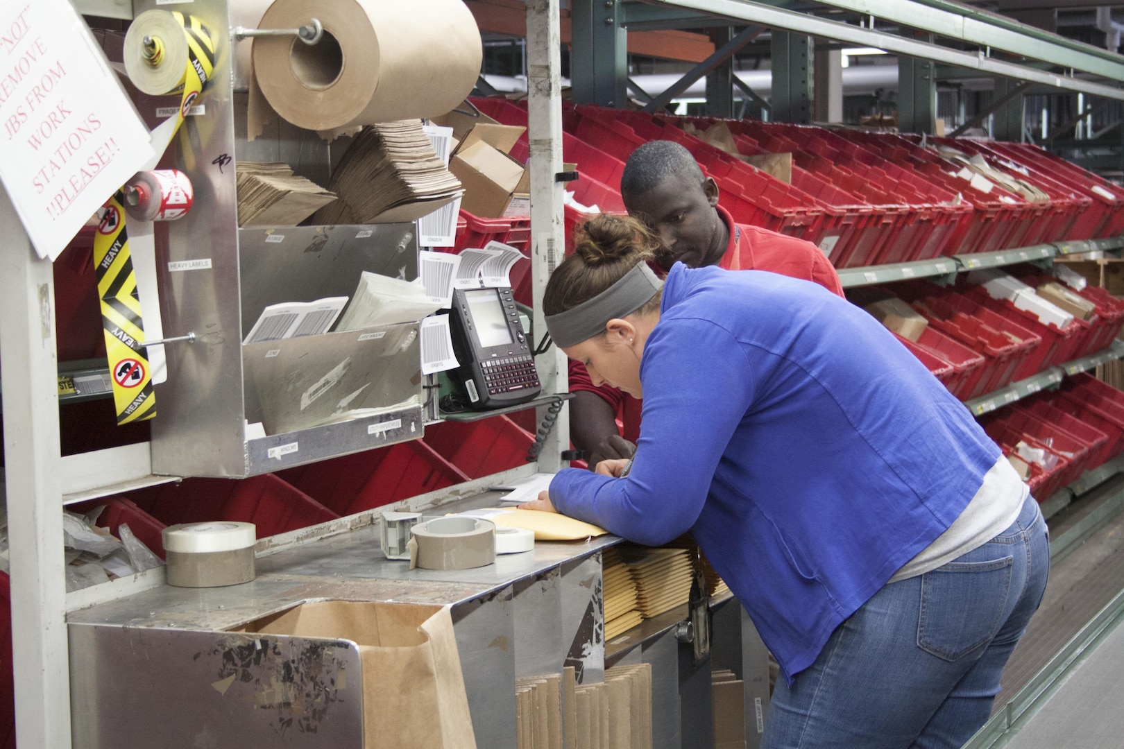 Brandi Spoon and Shawn Thomas, Defense Distribution Susquehanna employees pick and pack a rush order during the Nov. 6 ESOC COOP exercise. 
 
