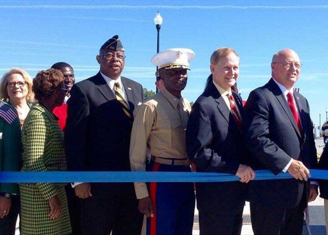 Col. James C. Carroll III, commanding officer, Marine Corps Logistics Base Albany, joins other local dignitaries, hundreds of veterans and community members for the dedication ceremony for the Broad Avenue Veterans Memorial Bridge, Nov. 11. “Thank you for your strong support of the military, he said. “MCLB Albany has been an integral part of this community and Southwest Georgia and the bond we share is just as strong today as it was in 1952. Many of the veterans here today have come through MCLB Albany and have remained here as retirees and employees. In my almost 30 years in the Marine Corps, I have traveled across this great nation and I have never run across a community that has a stronger bond with retirees as well as active duty that exists here in Albany, Georgia.”