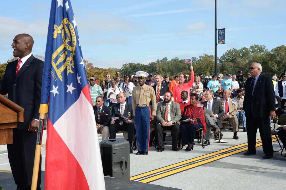 Col. James C. Carroll III, commanding officer, Marine Corps Logistics Base Albany, joins other local dignitaries, hundreds of veterans and community members for the dedication ceremony for the Broad Avenue Veterans Memorial Bridge, Nov. 11. “Thank you for your strong support of the military, he said. “MCLB Albany has been an integral part of this community and Southwest Georgia and the bond we share is just as strong today as it was in 1952. Many of the veterans here today have come through MCLB Albany and have remained here as retirees and employees. In my almost 30 years in the Marine Corps, I have traveled across this great nation and I have never run across a community that has a stronger bond with retirees as well as active duty that exists here in Albany, Georgia.”