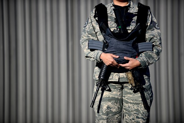 Two weapons poised in a baby carrier illustrate the message that all weapons should be handled with care; the same care you would extend to a child. Gun safety rules and recommendations are intended to eliminate or minimize the risks of unintentional death, injury or damage caused by improper possession, storage or handling of firearms.(U.S. Air Force photo by Tech. Sgt. Steven R. Doty)