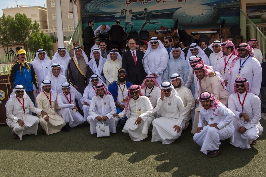 Douglas A. Silliman, the U.S. ambassador to Kuwait, stands with Kuwaiti dignitaries and community members during a celebration commemorating the 25th anniversary of the liberation of Kuwait at a local middle school in Kuwait City, Nov. 17, 2015. The event served as reminder of the Kuwaiti-U.S. commitment to strengthening their partnership. (U.S. Marine Corps photo By Lance Cpl. Clarence A. Leake/Released)