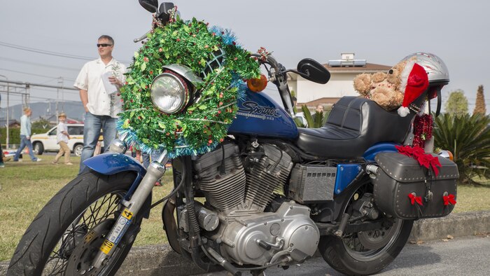 Japanese motorcycle clubs and motorcycle riders from the air station gathered at the Marine Thrift Store for the third-annual Toy Drive and Motorcycle Rally at Marine Corps Air Station Iwakuni, Japan, Nov. 22, 2015. Station residents and local Japanese donated toys for Japanese orphans and enjoyed decorated bikes and the roar of engines as the motorcyclists went on a Thunder Ride around base. (U.S. Marine Corps photo by Cpl. Nicole Zurbrugg/Released)