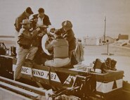Technicians assist Dr. John Paul Stapp into his rocket-powered sled at Holloman Air Force Base, New Mexico, in December, 1954.(Photo by AFMS Historian’s Office, San Antonio, Texas)