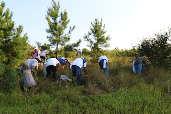 The Charleston District hosted the Second Annual Sweetgrass Pulling Day at the St. Stephen Powerhouse to allow local basket makers to pull naturally-growing sweetgrass to weave their baskets. Among those were the Horlbacks, who were pulling grass for the first time, even though they have been weaving for years.