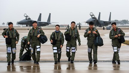 KUNSAN AIR BASE, Republic of Korea (Nov. 17, 2015) - F-15K Slam Eagle pilots from the Republic of Korea (ROK) air force 11th Fighter Wing, Daegu, share a laugh during Buddy Wing 15-7. During the five-day exercise, pilots from the 8th Fighter Wing exchanged tactics and procedures with their ROKAF counterparts. 