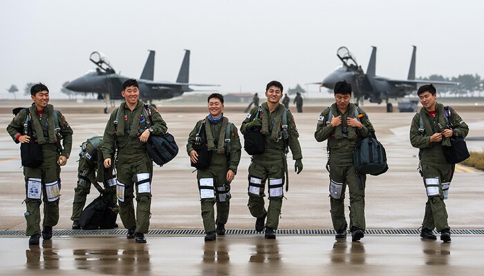 KUNSAN AIR BASE, Republic of Korea (Nov. 17, 2015) - F-15K Slam Eagle pilots from the Republic of Korea (ROK) air force 11th Fighter Wing, Daegu, share a laugh during Buddy Wing 15-7. During the five-day exercise, pilots from the 8th Fighter Wing exchanged tactics and procedures with their ROKAF counterparts. 