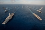 WATERS SOUTH OF JAPAN (Nov. 23, 2015) The Ronald Reagan Carrier Strike Group (RRNCSG) steams in formation with Japan Maritime Self-Defense Force ships for a photo exercise during Annual Exercise (AE) 16. RRNCSG is participating in AE16 to increase interoperability between Japanese and American forces through training in air and sea operations. 
