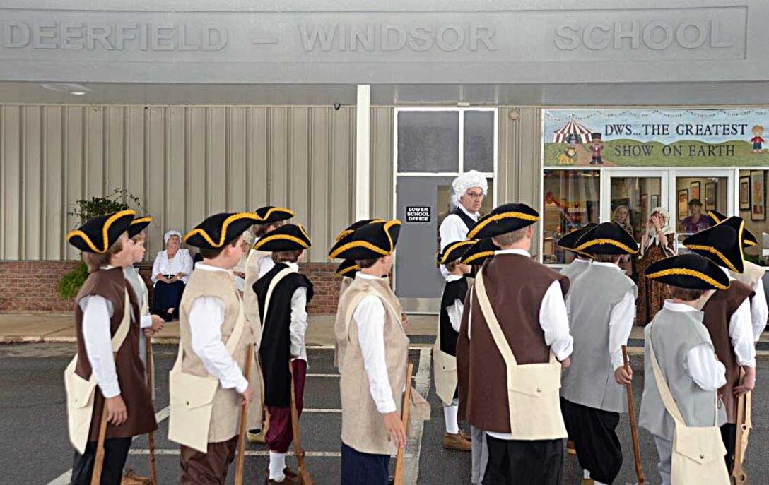 Kent Morrison, executive director, Marine Corps Logistics Base Albany, spends part of Nov. 19 helping fifth grade students at Deerfield-Windsor’s Lower School, Albany, Ga., learn about the American Revolution.