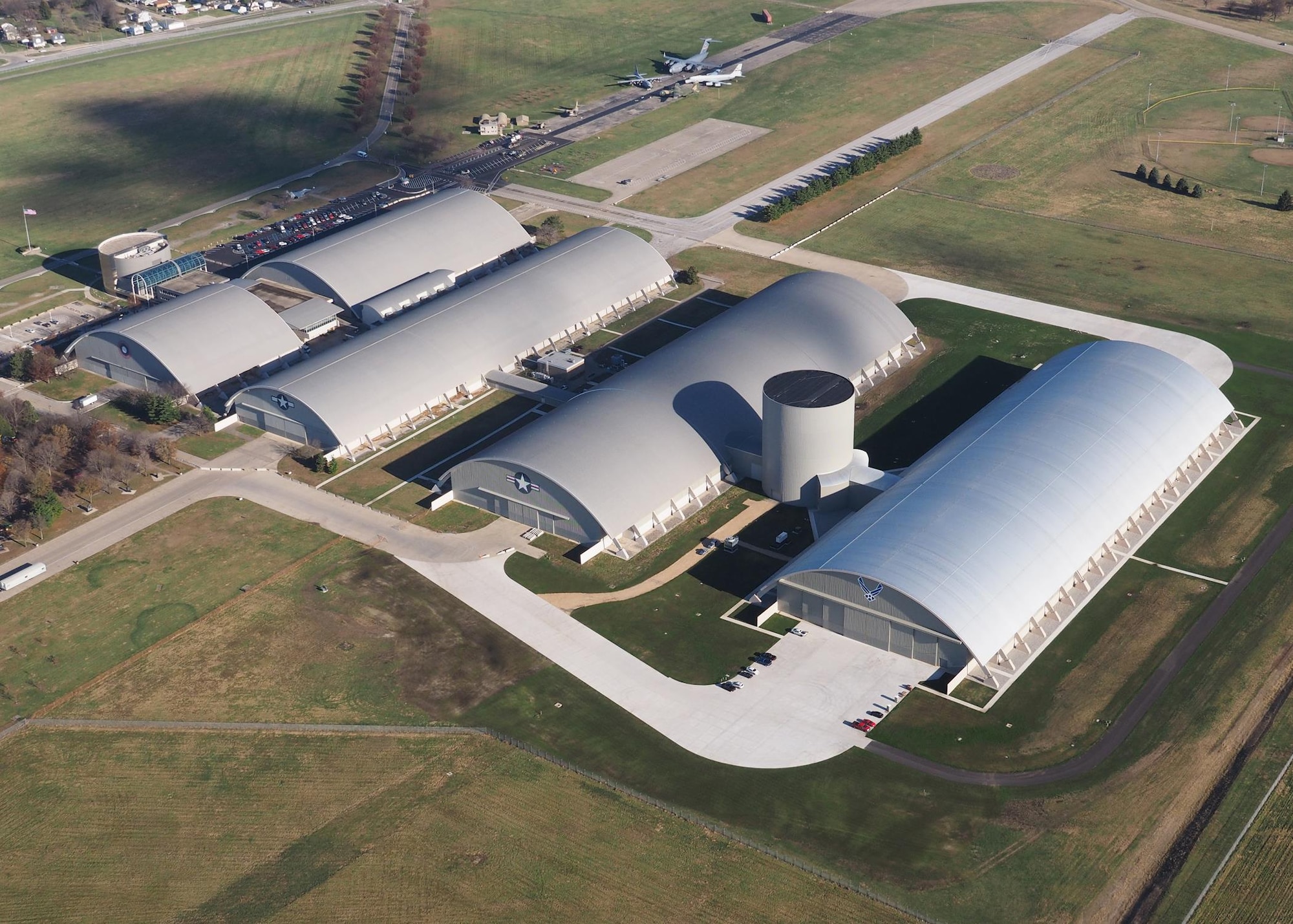 Aerial view of the National Museum of the U.S. Air Force during construction of the museum's fourth building on Nov. 13, 2015. The 224,000 square foot building, which is scheduled to open to the public in June of 2016, is being privately financed by the Air Force Museum Foundation, a non-profit organization chartered to assist in the development and expansion of the museum's facilities. (Photo courtesy of McKenrick Lee Photography)